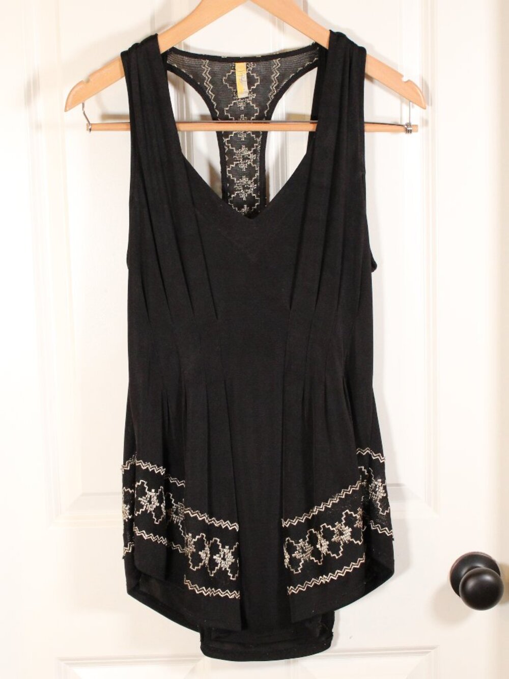 Free People black and gold peplum racerback tank top size s m